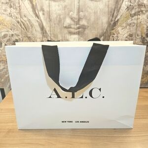 A.L.C. paper shopping bag